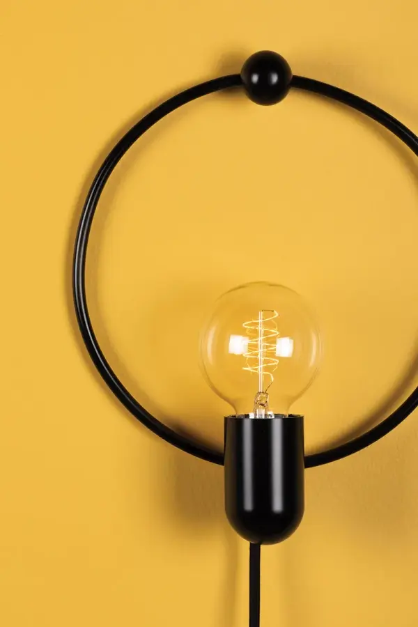 The Darcy Plug-In Sconce offers convenient no-hardwiring installation with a clean, transitional design. Perfect for renters or quick room updates, this affordable fixture provides functional task lighting with flexible placement options. - alternate view
