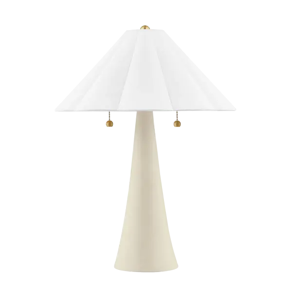 The Alana table lamp combines feminine elegance with functional design. Its white linen scalloped shade and aged brass details create a light, airy aesthetic perfect for traditional and coastal-inspired spaces.