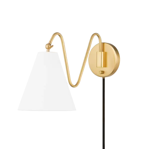 The Onda Plug-In Sconce brings artistic flair with its freehand doodle-inspired arms and pivoting white linen shades. Part of the Tali Roth collaboration, it offers flexible installation and warm, diffused lighting perfect for modern spaces.