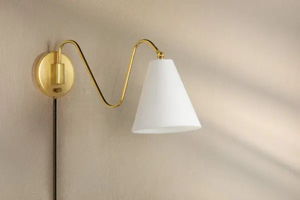 The Onda Plug-In Sconce brings artistic flair with its freehand doodle-inspired arms and pivoting white linen shades. Part of the Tali Roth collaboration, it offers flexible installation and warm, diffused lighting perfect for modern spaces. - alternate view