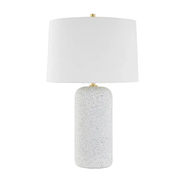 The Margaret Table Lamp showcases casual blue-grey terrazzo with Megan Molten's signature aesthetic, complemented by sophisticated Aged Brass accents. Perfect for adding welcoming ambiance to entryways or as coordinated pairs.