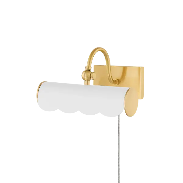 The Fifi Picture Light brings fresh sophistication to artwork display with its charming scalloped edge and curved arm. Part of the Ariel Okin collaboration, this plug-in fixture offers easy installation and timeless appeal.