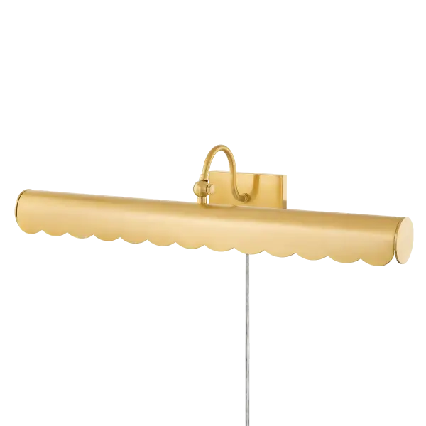 The Fifi Picture Light brings warmth and sophistication to artwork displays with its scalloped edge design and curved arm. Part of the Ariel Okin x Mitzi collaboration, it offers a fresh take on traditional picture lighting.