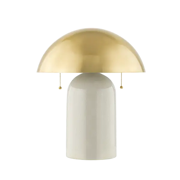 The Gaia Table Lamp reimagines the classic banker's lamp with contemporary flair. Its oversized antique brass dome shade paired with a hand-crafted white crackle glaze ceramic base creates a stunning focal point.