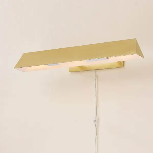 The Priscilla Picture Light delivers sophisticated illumination for artwork with its angular profile and clean lines. The Aged Brass finish adds warmth while the versatile design complements any decor style without competing with your art. - alternate view