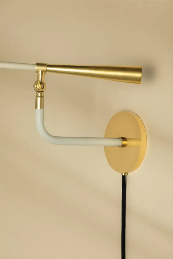 The Milena brings bold mid-century style with oversized reflector shades that pivot for customized light direction. Part of the Tali Roth x Mitzi collaboration, this plug-in sconce combines futuristic aesthetics with functional flexibility. - alternate view