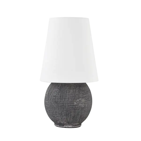 The Ulsterville combines artifact-like ceramic craftsmanship with modern rechargeable LED technology. Its oversized linen shade and textured spherical base create a striking focal point despite its petite size, perfect for versatile styling.