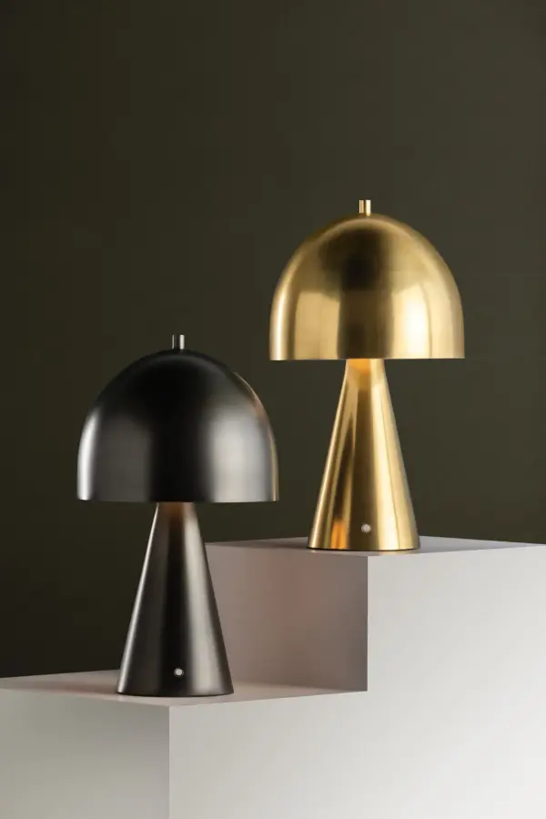 The Hopkinton rechargeable table lamp combines striking geometric design with modern portability. Its mushroom silhouette features an oblong domed shade atop a conical base, creating visual interest in any space. - alternate view