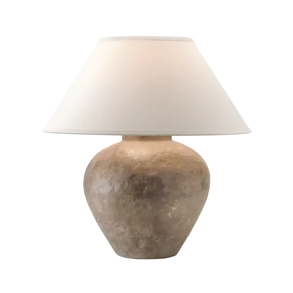 The Calabria Table Lamp brings sun-soaked Mediterranean elegance to any space with its earthy, textural ceramic base and curvy silhouette. The large conical linen shade complements the rustic organic aesthetic perfectly.