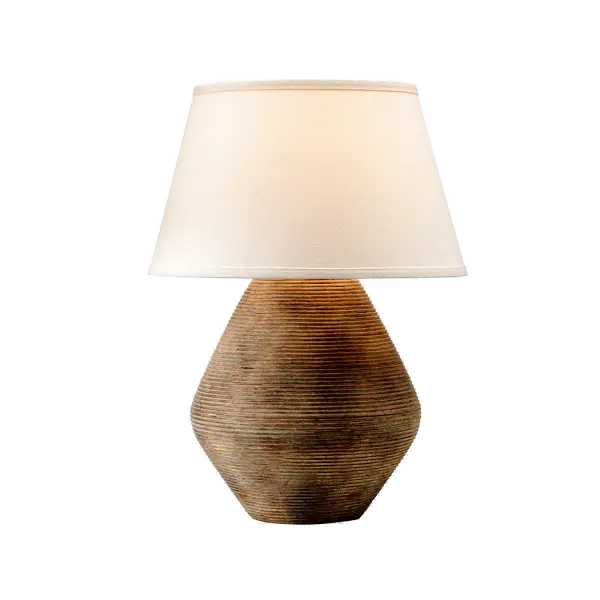 The Calabria Table Lamp brings sun-soaked Mediterranean elegance to any space with its earthy textural finish and curvy silhouette. The large conical linen shade complements the rustic ceramic base perfectly.