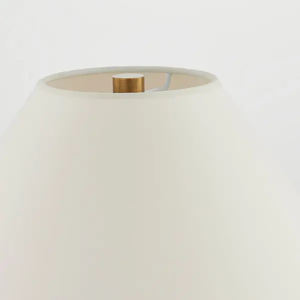 Bond Table Lamp combines natural parchment wrapping with sophisticated brass accents for a relaxed yet elevated aesthetic. The stitch detailing and clasp-like hardware add artisanal charm while the tapered shade creates warm, ambient lighting. - alternate view