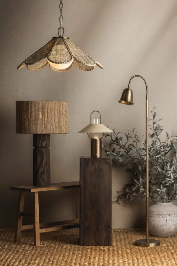 The Kindle combines vintage-inspired design with modern portability. At 14.5" high with a convenient carry handle, this rechargeable lamp moves effortlessly indoors and out. The tapered Soft Sand shade and Patina Brass finish create warmth. - alternate view