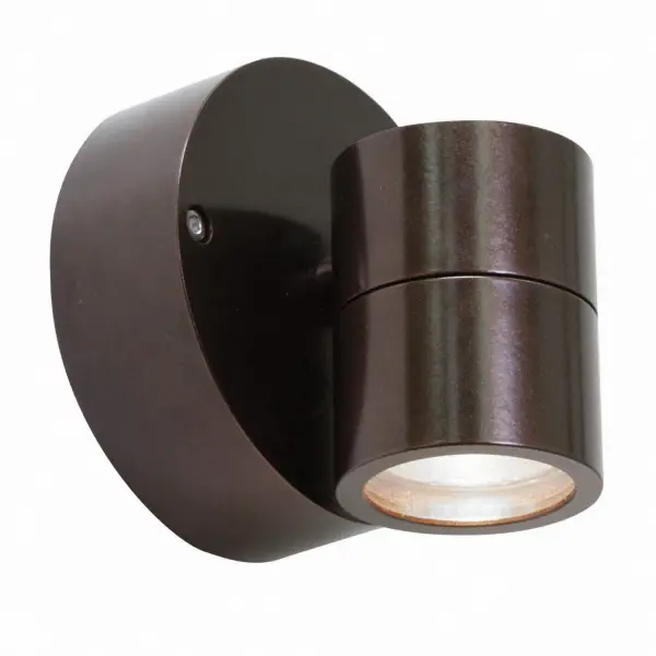 The KO spotlight delivers precise directional lighting in a compact 4.25-inch design. Its bronze finish and clear glass shade provide versatile styling for both residential and commercial spaces requiring focused illumination.