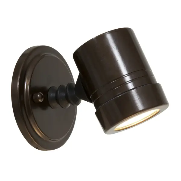 The Myra spotlight delivers focused task lighting in a compact 4.5-inch design. Its bronze finish and clear glass shade provide timeless appeal while the adjustable head allows precise light direction.