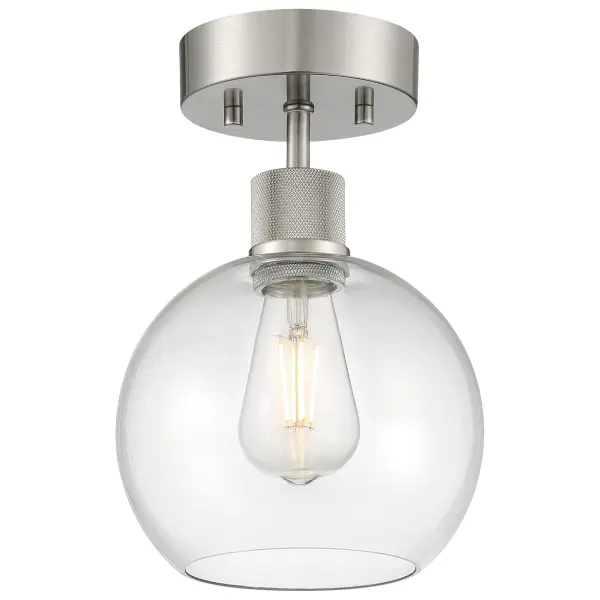 The Port Nine semi-flush mount delivers warm, efficient LED lighting in a compact 7.5" profile. Its brushed steel finish and clear glass shade provide versatile style for smaller spaces requiring reliable overhead illumination.