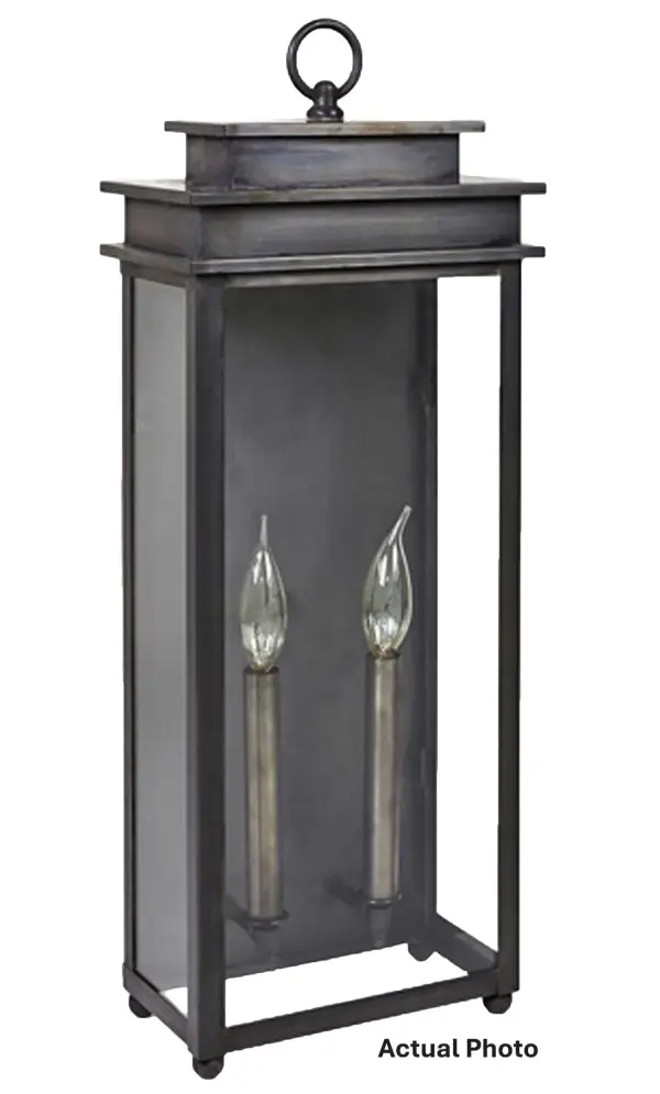 The Ellis Collection offers squared-off steps and an open bottom for maximum illumination and a transitional look that balances modern and traditional elements. This collection is perfect for your home inside or out. Large Ellis Wall Light Dimensions: 9.25"W x 5.75"D x 24.25"H Mounting height (From top to mounting bracket): 14.5"H Bulb type: Two 60-Watt Candelabra Base Bulb Suitable location: Wet Mounting Area: 7.5"W x 16"H Contact Dealer for Pricing & Availability Download a Spec Sheet Note: Some photos are a digital rendering to show our finish, glass and socket options our actual finishes are hand-applied and our glass is hand-blown and will have natural variations from the photos.