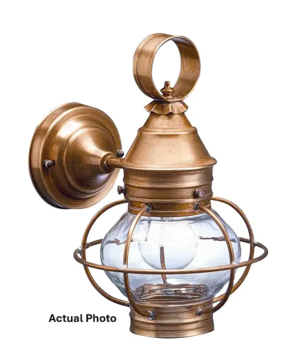 Evoking the classic lanterns from New England's rich nautical history, the Caged Onion collection features an iconic shape with a handcrafted brass or copper cage, protecting the hand-blown glass globe. Crafted with a detachable globe, they are easy to clean and maintain. The classic design makes them one of the most popular lights we make and is the inspiration for our company logo. Small Caged Onion Wall Light Dimensions: 8"W x 10"D x 12"H Mounting height (From top to mounting bracket): 6" Bulb type: One 75-Watt Medium Base Bulb Suitable location: Wet Mounting Area: 5.25" Diam. Contact Dealer for Pricing & Availability Download Spec Sheet Note: Some photos are a digital rendering to show our finish, glass and socket options our actual finishes are hand-applied and our glass is hand-blown and will have natural variations from the photos.