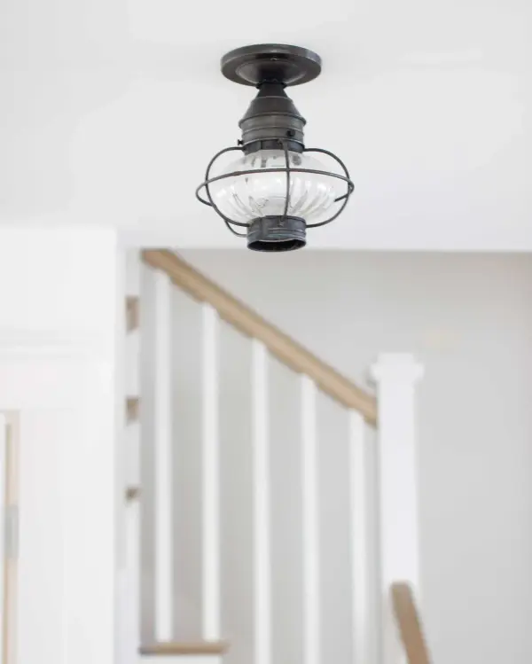 Evoking the classic lanterns from New England's rich nautical history, the Caged Onion collection features an iconic shape with a handcrafted brass or copper cage, protecting the hand-blown glass globe. Crafted with a detachable globe, they are easy - alternate view