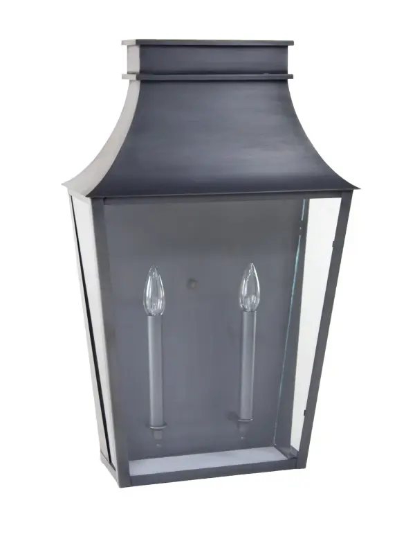 Named after one of the most beautiful, historic towns on the seacoast of New Hampshire and where Northeast Lantern calls home. Inspired by the enduring elegance of historic architecture, this handcrafted lantern is a true testament to timeless design. It features a gracefully flared crown and tapered body that evokes the charm of traditional gas lamps once found along historic streets. Perfect for entryways, courtyards, or garden paths, it brings a refined sense of heritage and sophistication to any exterior setting. Exeter Large Wall Light Dimensions: 15"W x 7.5"D x 24"H Mounting height (From top to mounting bracket): 13.75" Bulb type: Two 60-Watt Candelabra Suitable location: Wet Mounting Area: 10"W x 14.5"H Contact Dealer for Pricing & Availability Download Spec Sheet Note: Some photos are a digital rendering to show our finish, glass and socket options our actual finishes are hand-applied and our glass is hand-blown and will have natural variations from the photos.