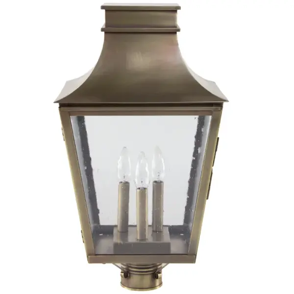 Named after one of the most beautiful, historic towns on the seacoast of New Hampshire and where Northeast Lantern calls home. Inspired by the enduring elegance of historic architecture, this handcrafted lantern is a true testament to timeless design. It features a gracefully flared crown and tapered body that evokes the charm of traditional gas lamps once found along historic streets. Perfect for entryways, courtyards, or garden paths, it brings a refined sense of heritage and sophistication to any exterior setting. Exeter Post Light Dimensions: 12"W x 12"D x 21.5"H Bulb type: Three 60-Watt Candelabra Suitable location: Wet Mounting Area: 3" Fitter Contact Dealer for Pricing & Availability Download Spec Sheet Note: Some photos are a digital rendering to show our finish, glass and socket options our actual finishes are hand-applied and our glass is hand-blown and will have natural variations from the photos. - alternate view