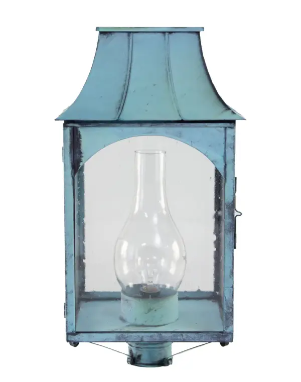 The Kensington collection reflects the character of its namesake town: quiet, crafted, and rooted in natural simplicity. Hand-formed in brass or copper, its flared roofline and clear glass chimney give the feel of a traditional lantern while delivering refined, durable construction. This piece brings the warmth of artisan workmanship to any exterior, with a silhouette inspired by the forests and small-town heritage of Kensington, NH. Kensington Post Light Dimensions: 12.5"W x 12.5"D x 23.5"H Bulb type: Three 60-Watt Candelabra or One 75-Watt Medium Base with Clear Chimney Suitable location: Wet Mounting Area: 3" Fitter Contact Dealer for Pricing & Availability Download Spec Sheet Note: Some photos are a digital rendering to show our finish, glass and socket options our actual finishes are hand-applied and our glass is hand-blown and will have natural variations from the photos. - alternate view