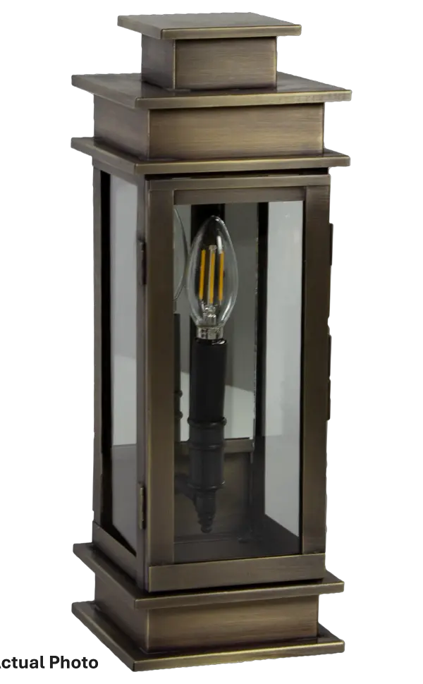 A fusion of streamlined contemporary style and traditional heritage, the Empire collection is highlighted by a double-tiered top with hard edges and flat sides. A unique design with two bulbs and an optional mirrored back panel for a sophisticated detail and reflecting more light. Perfect for indoor and outdoor use. Small Empire Wall Light Dimensions: 5.5"W x 5.75"D x 15.5"H Mounting height (From top to mounting bracket): 8.25" Bulb type: One 60-Watt Candelabra Socket Suitable location: Wet Mounting Area: 4"W x 9"H Contact Dealer for Pricing & Availability Download Spec Sheet Note: Some photos are a digital rendering to show our finish, glass and socket options our actual finishes are hand-applied and our glass is hand-blown and will have natural variations from the photos.