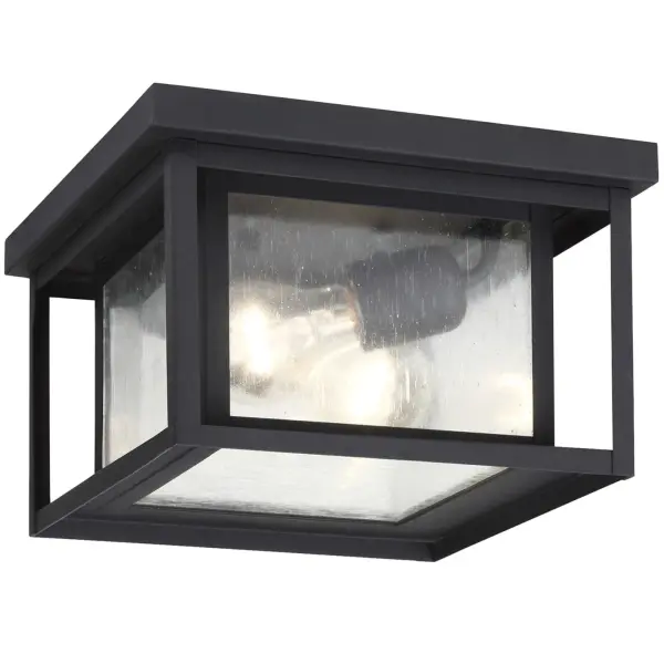 The Hunnington outdoor flush mount combines durability with timeless design. Its black aluminum construction and clear seeded glass create visual interest while the compact 10-inch profile fits tight spaces perfectly.