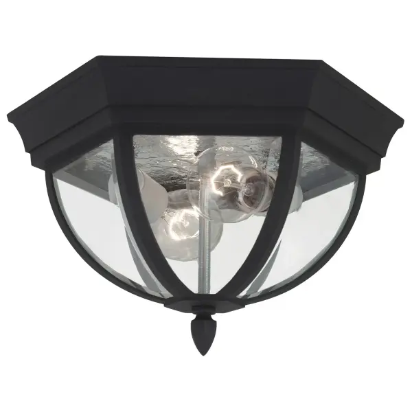 The Wynfield outdoor flush mount combines timeless design with practical functionality. Its black aluminum construction and clear beveled glass create a refined look that complements traditional and coastal exteriors.