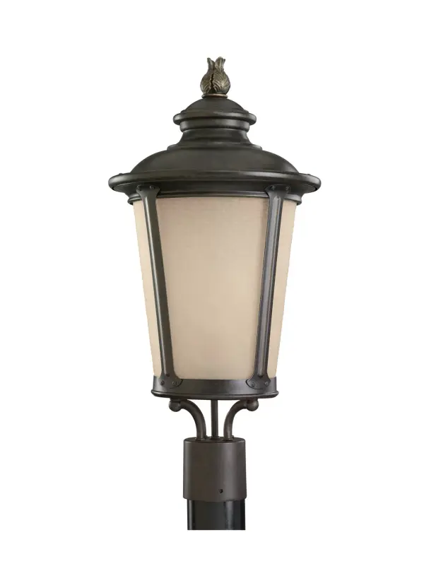 The Cape May post lantern combines traditional maritime styling with modern LED efficiency. Its burled iron finish and amber-tinted glass create inviting outdoor ambiance while wet-rated construction ensures durability.