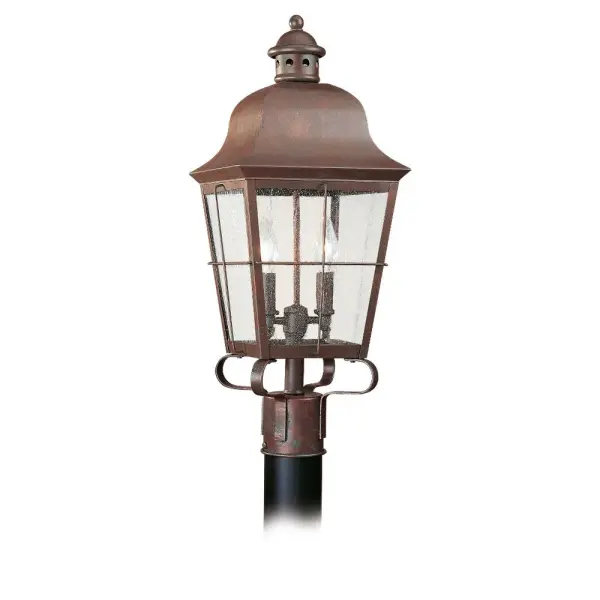 The Chatham post lantern brings traditional nautical elegance to outdoor spaces with its weathered copper finish and clear seeded glass. Compact at 9.25" square, it's ideal for pathways, driveways, and entryways.