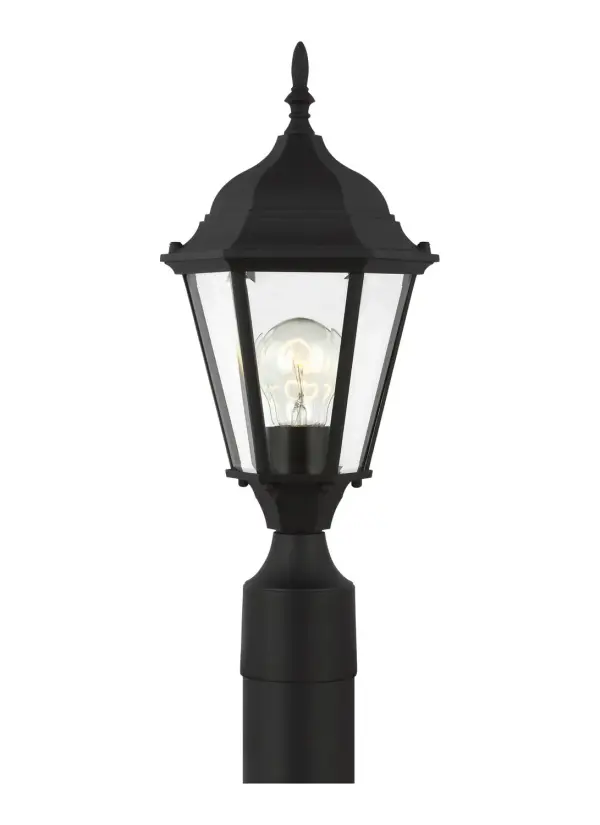 The Bakersville post lantern delivers timeless curb appeal with its traditional black aluminum frame and clear beveled glass panels. Compact at under 8 inches wide, it's ideal for smaller posts and pathways while providing ample illumination.