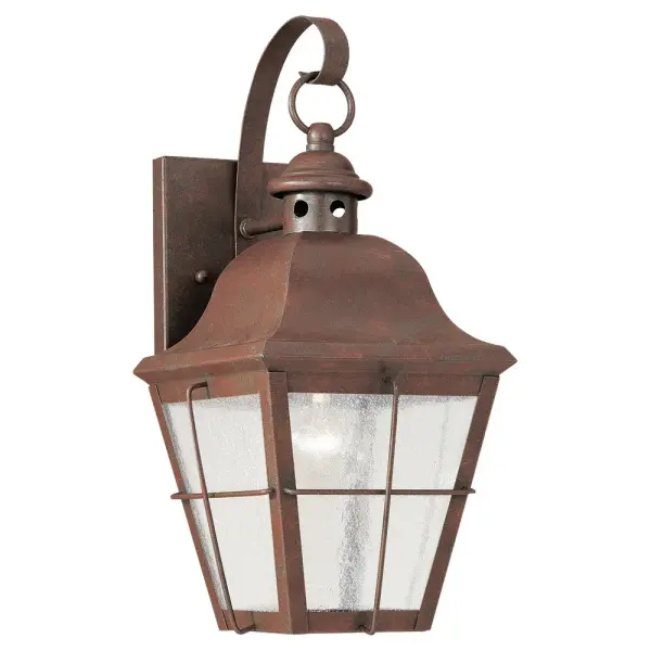The Chatham wall lantern brings timeless outdoor elegance with its weathered copper finish and clear seeded glass. Compact at 6.75" wide, it's perfect for flanking doors or illuminating smaller outdoor spaces with warm, inviting light.