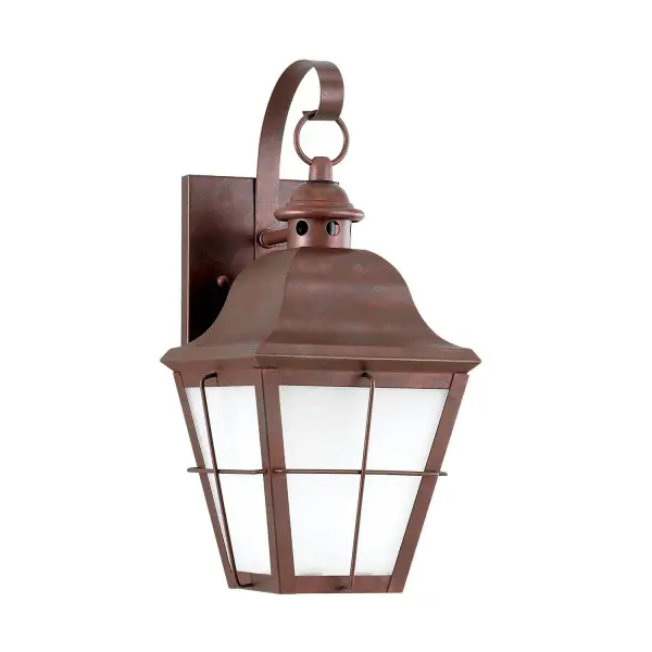 The Chatham wall lantern brings timeless outdoor elegance with its weathered copper finish and clear seeded glass. Compact at 6.75" wide, it's perfect for flanking doorways or illuminating smaller outdoor spaces with warm, welcoming light.