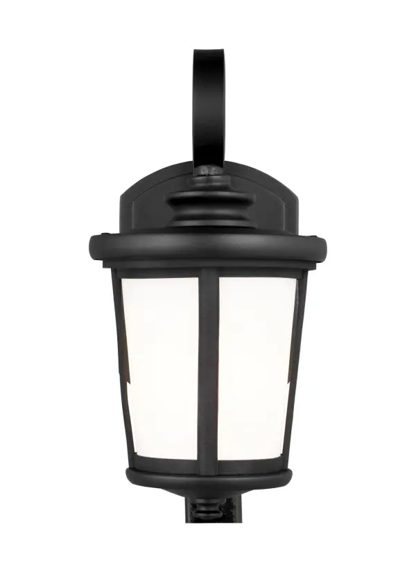 The Eddington wall lantern delivers classic styling in a compact 6-inch profile, perfect for smaller outdoor spaces. Its wet-rated aluminum construction and cased opal glass provide reliable illumination and weather resistance.