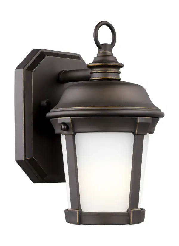 The Calder wall lantern delivers classic styling in a compact 6-inch width, perfect for smaller outdoor spaces. Its wet-rated construction and integrated LED provide reliable, maintenance-free illumination.