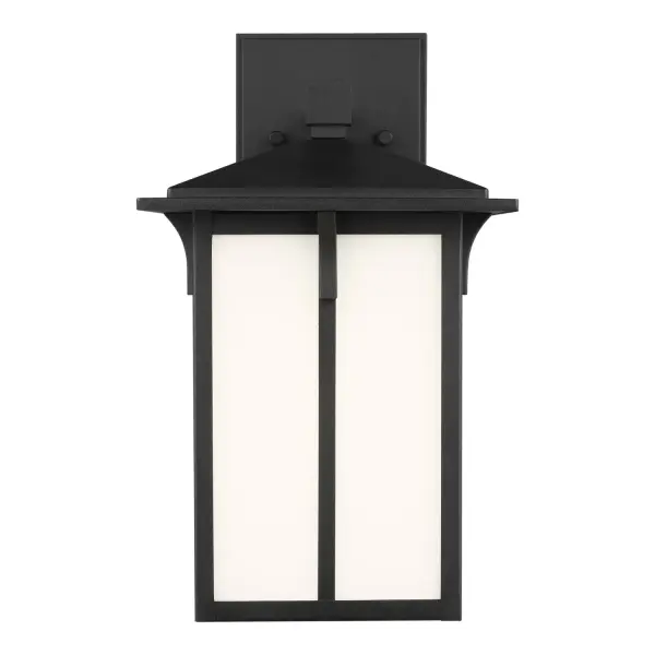 The Tomek outdoor wall lantern combines durability with understated style. Its aluminum construction and wet rating make it ideal for exposed locations, while the etched white glass provides soft, diffused light.