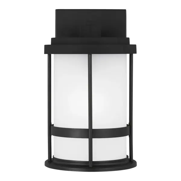 The Wilburn outdoor wall lantern delivers reliable wet-rated performance in a compact 6-inch profile. Its black aluminum construction and satin etched glass suit coastal homes and transitional architecture alike.
