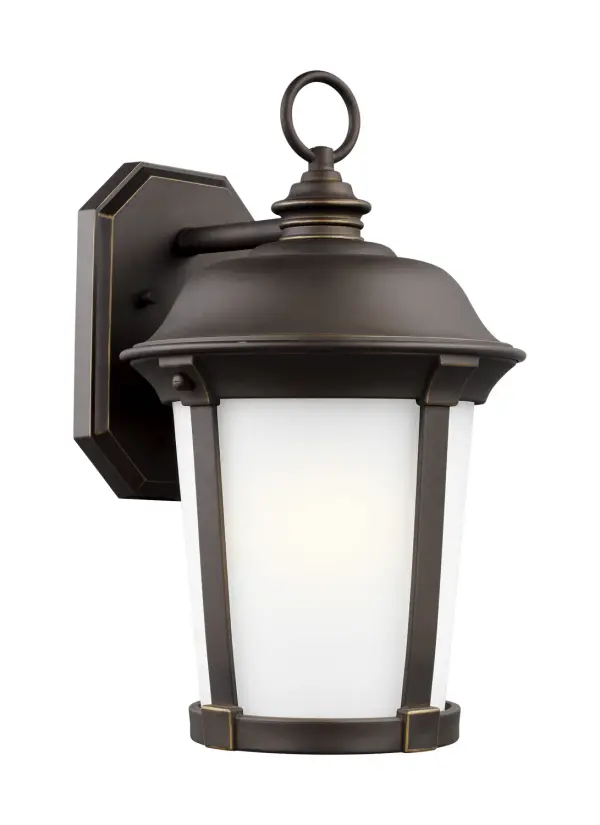 The Calder wall lantern combines traditional styling with modern LED efficiency. Its compact 10-inch width and wet-rated construction make it ideal for entryways and porches requiring reliable outdoor lighting.