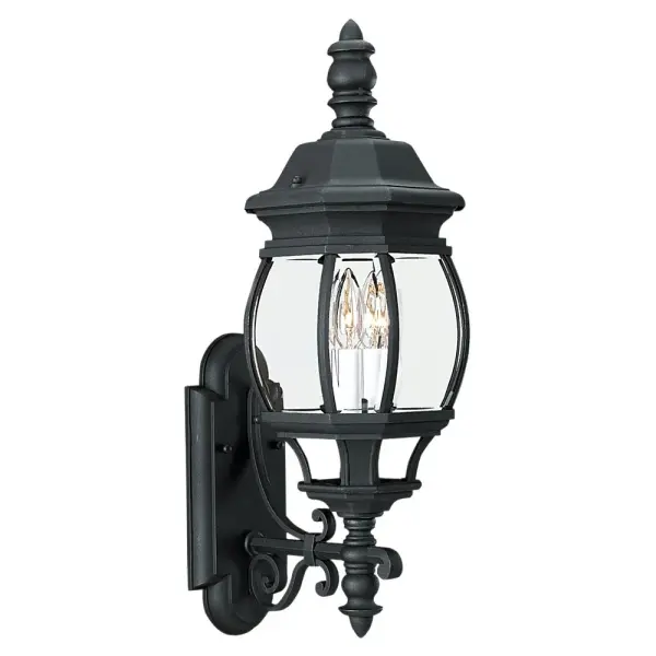 The Wynfield wall lantern delivers traditional elegance with its black finish and clear beveled glass panels. At 23.5 inches tall, it provides substantial presence for outdoor entryways and porches while maintaining classic proportions.