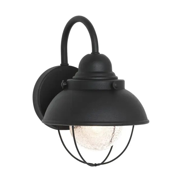 The Sebring wall lantern combines timeless design with practical outdoor performance. Its compact 8-inch width and clear seeded glass create welcoming illumination for entryways and porches without overwhelming smaller spaces.