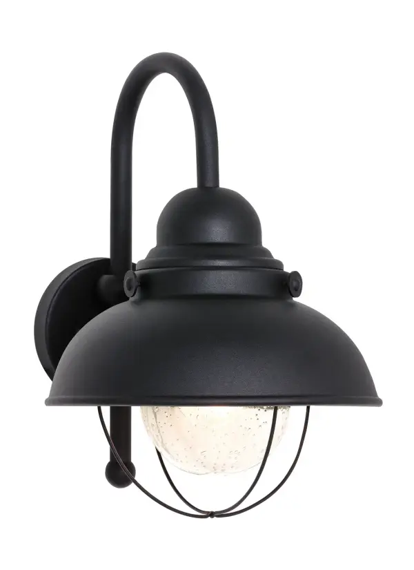 The Sebring wall lantern combines traditional lantern styling with modern durability. Its aluminum construction and wet rating make it ideal for exposed outdoor locations, while clear seeded glass adds vintage charm.