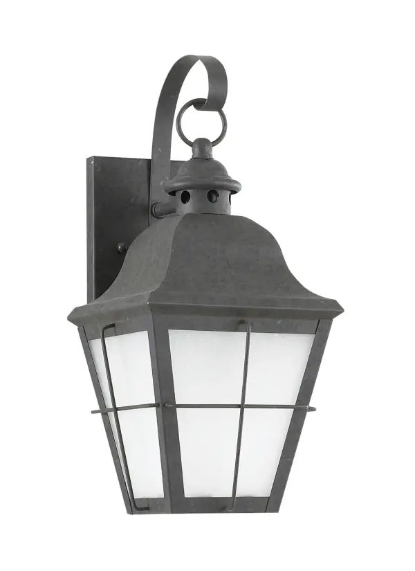 The Chatham wall lantern combines traditional styling with practical outdoor performance. Its compact 6.75" width and frosted seeded glass create welcoming illumination for entryways and porches.