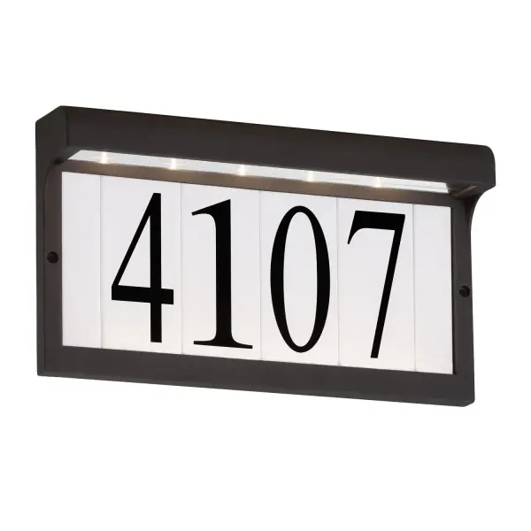 This compact address light combines modern design with practical LED technology. The wet-rated aluminum construction ensures durability in all weather conditions, while the integrated 2700K LED provides warm, welcoming illumination.