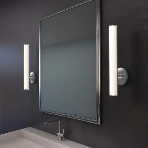 The Bauhaus Columns LED Bath Bar combines clean geometric lines with energy-efficient LED technology. Its polished chrome finish and cylindrical glass columns create a sophisticated modern aesthetic perfect for contemporary bathrooms.