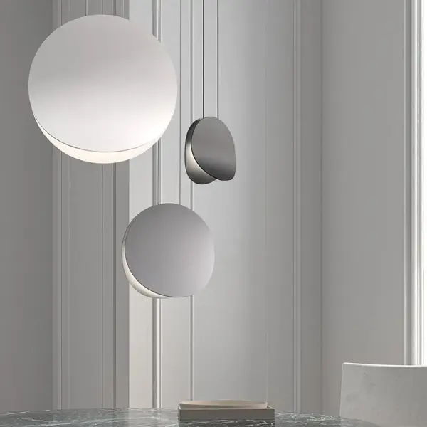 The Malibu Discs LED Pendant features sweeping opposing discs that create a dynamic sculptural presence. Available in multiple sizes for individual or clustered installations, this energy-efficient LED fixture brings contemporary sophistication to any space.