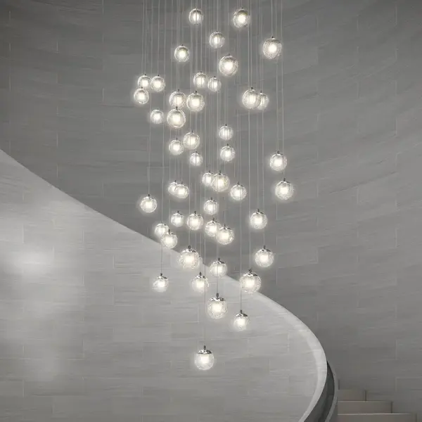 The Champagne Bubbles LED Chandelier transforms light into a mesmerizing display through bubble-filled glass spheres. Its compact 12-inch diameter and integrated LED technology make it perfect for intimate spaces seeking modern glamour.