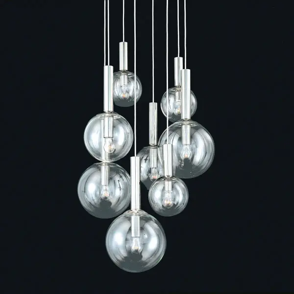 The Bubbles pendant delivers dramatic visual impact with eight clear glass spheres arranged in an artistic cluster. The polished nickel finish adds refined sophistication while the generous 29-inch width makes a bold statement.