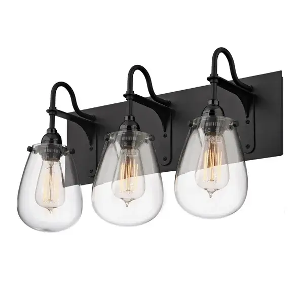 The Chelsea Bath Bar channels vintage Hollywood glamour with its sleek satin black finish and clear glass shades designed for vintage carbon filament bulbs. The 19.25-inch width makes it ideal for medium vanities.