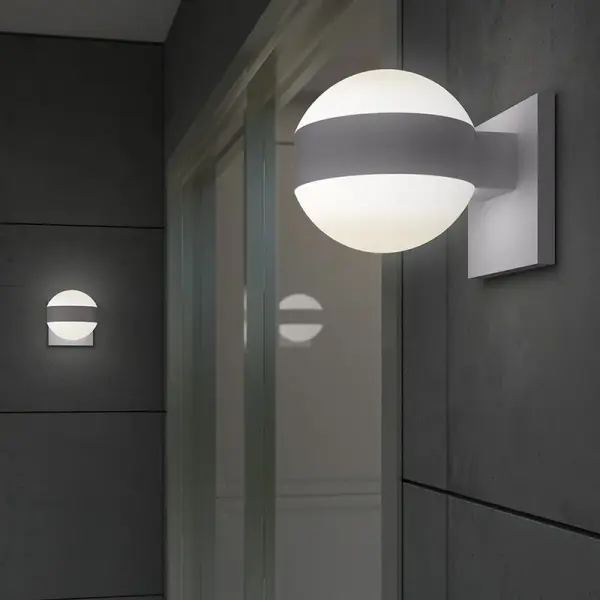 The REALS Up/Down LED Sconce delivers modern architectural lighting with energy-efficient LED technology. Its polished nickel finish and bidirectional light create ambient illumination perfect for hallways and accent walls.