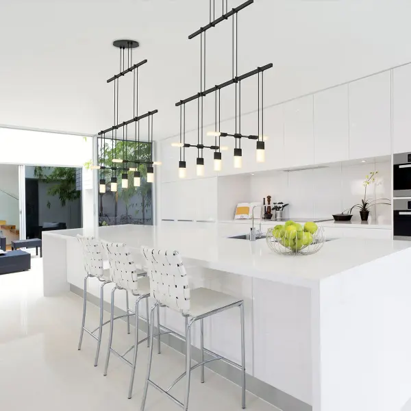 The Suspenders 36" creates a striking horizontal statement with its 2-tier design and etched glass chiclet luminaires. Perfect for contemporary dining spaces and commercial settings requiring clean, linear lighting.